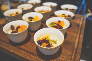 Delicious desserts on the tray. Delicious chocolate desserts and mousses. Toning.
