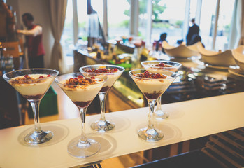 Delicious desserts on the tray. Delicious chocolate desserts and mousses. Toning.
