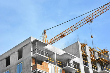 Crane and highrise construction site