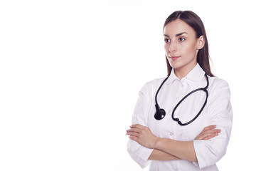 Fototapeta premium Modern Woman doctor with stethoscope and crossed hands looking into the camera isolated on white background with copyspace.