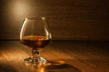 Cognac drinks glass on dark background