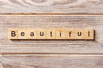 Beautiful word written on wood block. Beautiful text on table, concept