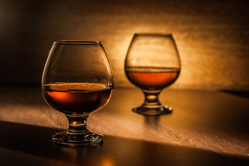 Cognac drinks glass on dark background