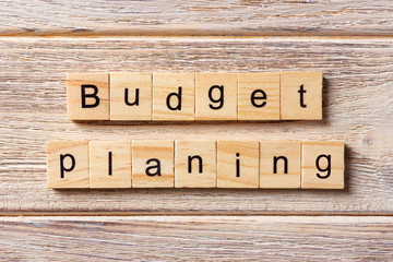 Budget planing word written on wood block. Budget planing text on table, concept