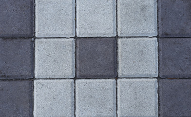 Stone paving tiles of different shapes and colors