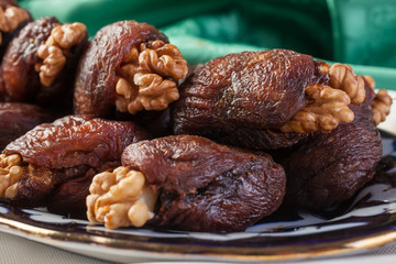 Walnuts and dried apricots.Oriental dessert.Selective focus.
