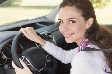 Plakat Young woman driving her car