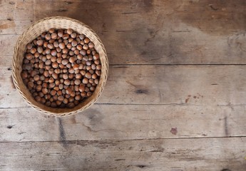 Hazelnuts basket on a wooden rustic  table background