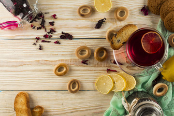 Cup of tea and leaves tea on white wooden table