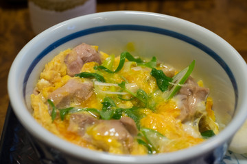 Oyako-don, a bowl of rice topped with chicken and eggs. (Japanese food)