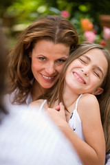 Woman holding a laughing girl