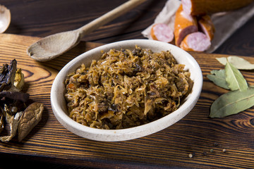 Cabbage stew with meat, mushrooms and dried plums - traditional polish dish