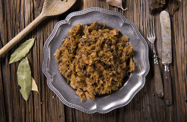 Cabbage stew with meat, mushrooms and dried plums - traditional polish dish