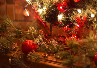 Obraz na płótnie Canvas Festive Christmas Wreath Over a Fireplace