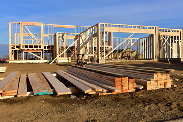 Wood frame apartment building under construction.