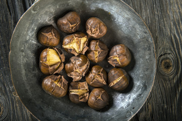 Chestnuts on wooden background