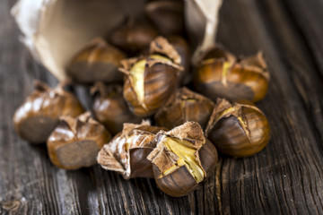 Chestnuts on wooden background