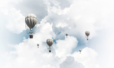 Flying hot air balloons in the air.