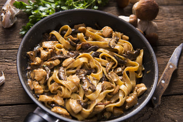 Tagiatelle pasta with creamy sauce with porcini mushrooms