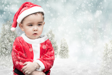 Cute santa kid with falling snow