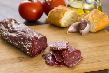 Salami with bread and tomatoes
