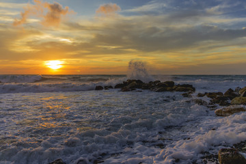 Fototapeta premium Fantastic sunset over the stormy sea. Dramatic overcast sky. Black Sea near Anapa