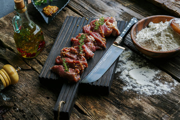 raw meat for cooking of national dishes, on wooden Board