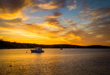 sunrise over a fishing boat
