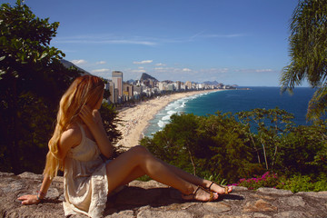 young woman with long hair view Ipanema beach in Rio