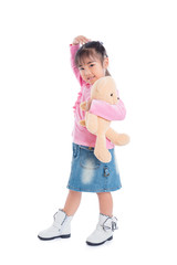 Young asian girl holding teddy bear and smiles isolated over white background