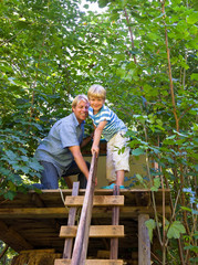 Father and son building treehouse