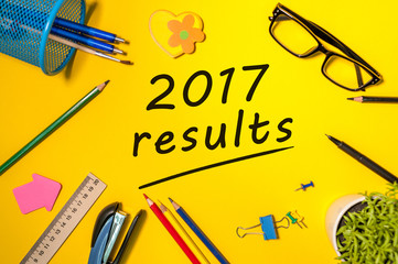 2017 results text on a yellow workplace. The concept of achievements and failures of career and business at the Year