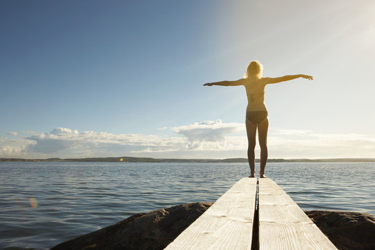 Young Woman On Diving Board