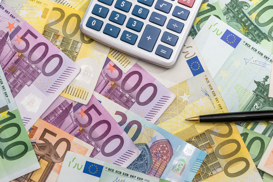 pen calculator and  euro banknotes . close up