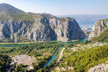 Fototapeta na wymiar Omish, Croatia, panorama, the Cetina river basin in the sea