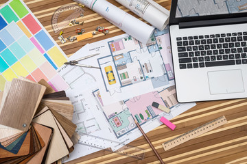 laptop with plan of apartment rooms, draw tolls