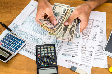 Naklejka premium tax concept - form, calculator, pen, dollar and phone