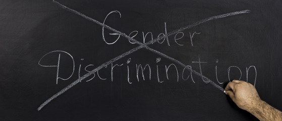Gender discrimination Concept on Dark Background.Drawn with chalk on blackboard