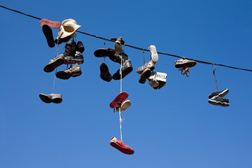 Shoes hanging from power line