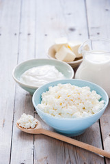 Organic Farming Cottage cheese in a blue bowl, sour cream, butter and milk