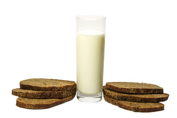 Milk in a glass fresh paired with sliced ??rye bread. Isolated on white background.