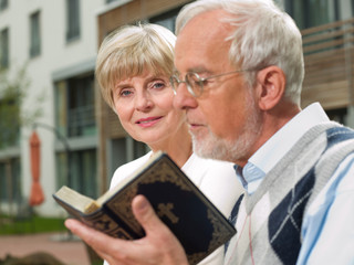 Senior couple with a bible