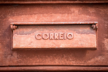 Old rusty mailbox with the word 