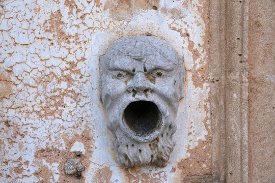 Bagheria, Sicily, Italy. Bas-relief - a device for extinguishing torches in the villa of Palagonia, XVIII century