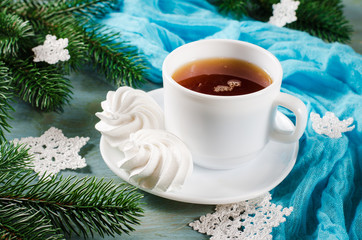 Obraz na płótnie Canvas Delicious meringue cookies and cup of hot tea.