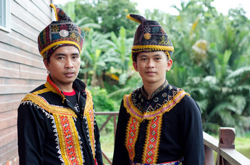 Young Men From Indigenous people of Sabah Borneo in East Malaysia in traditional attire during...