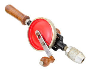 Old single pinion manual egg beater style hand drill isolated on a white background