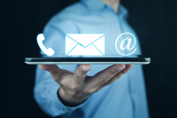 Man holding contact icons.