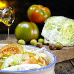 Tomato and vegetable salad dressed with olive oil