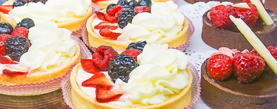Fresh Fruit Tarts and Chocolate Tortes in Bakery